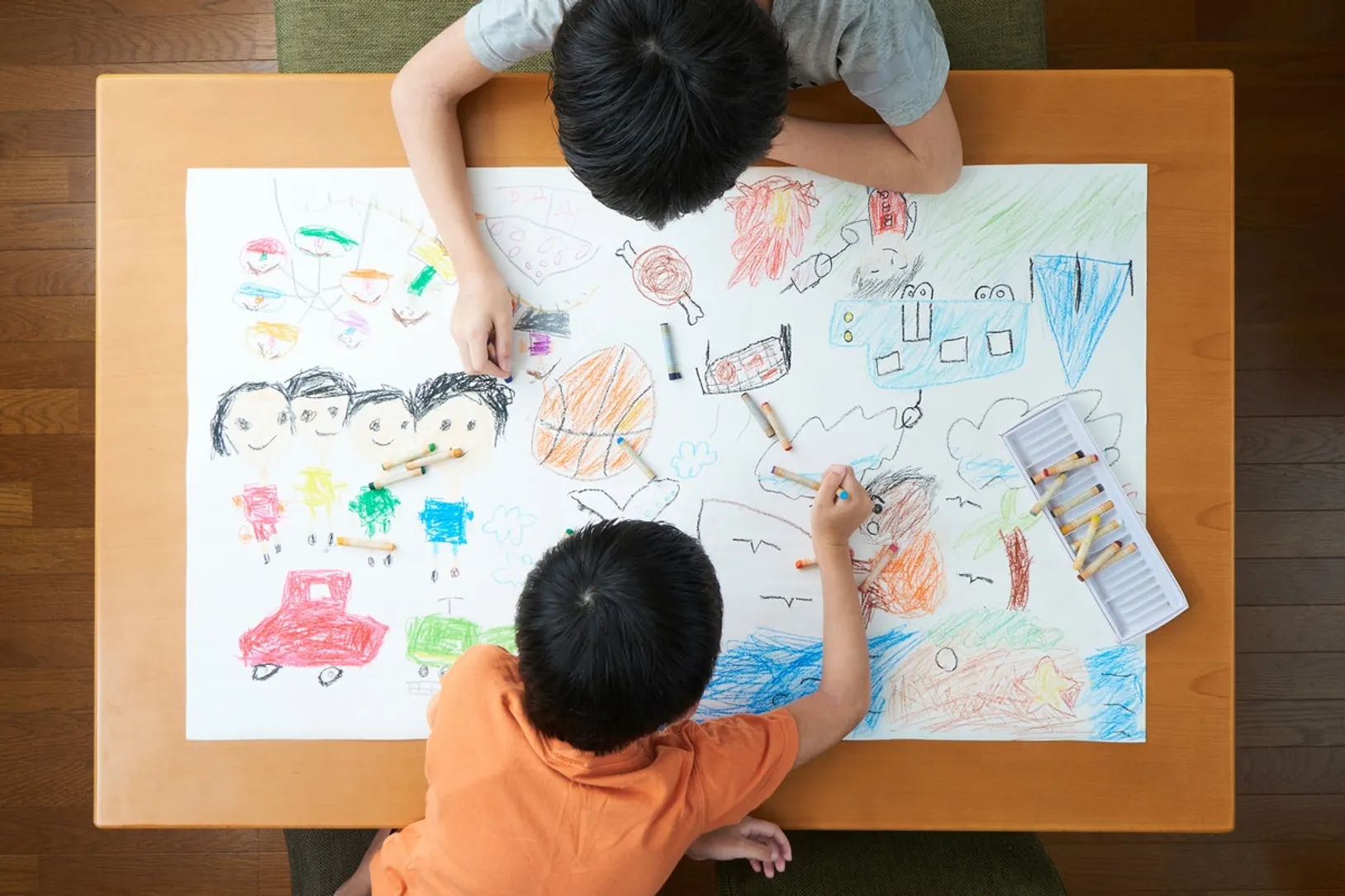 Child drawing with caregiver